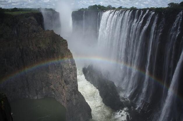The Victoria Falls are a waterfall in the Zambezi River, on the border between Zambia and  Zimbabwe.